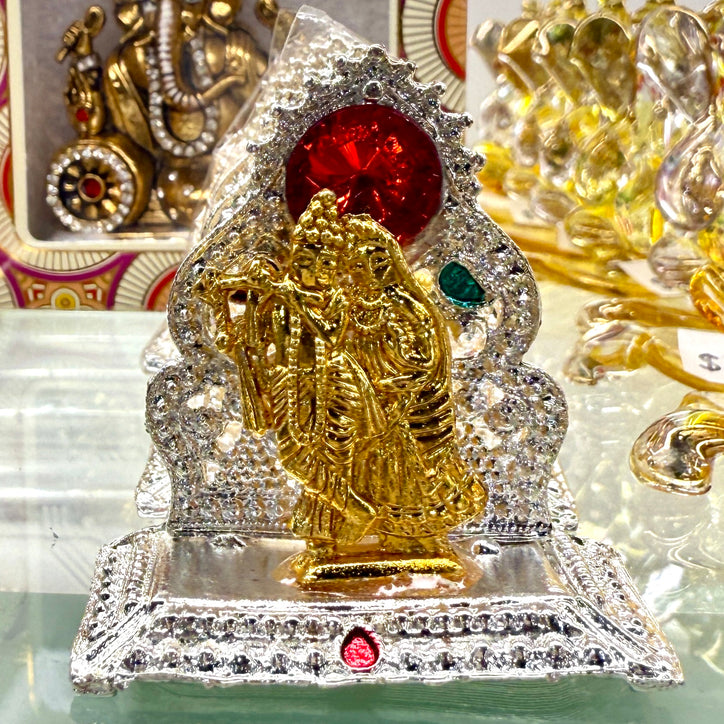 Shri Radha Krishna Ji Idol (2”) – Golden Miniature Murti with Silver Throne & Gemstone Arch