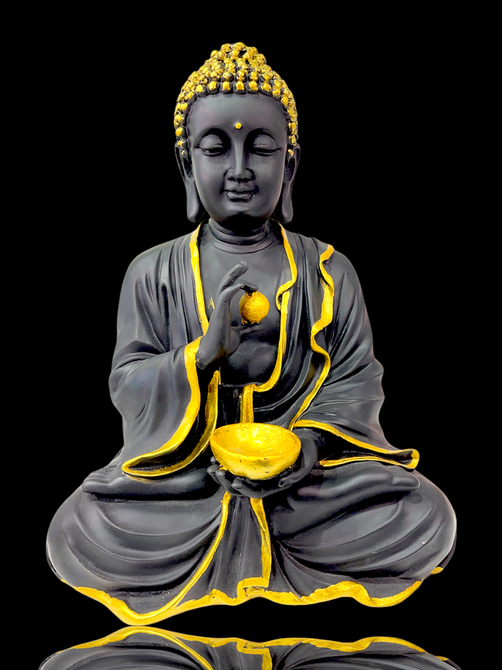 Black/White Buddha holding gold ball & bowl