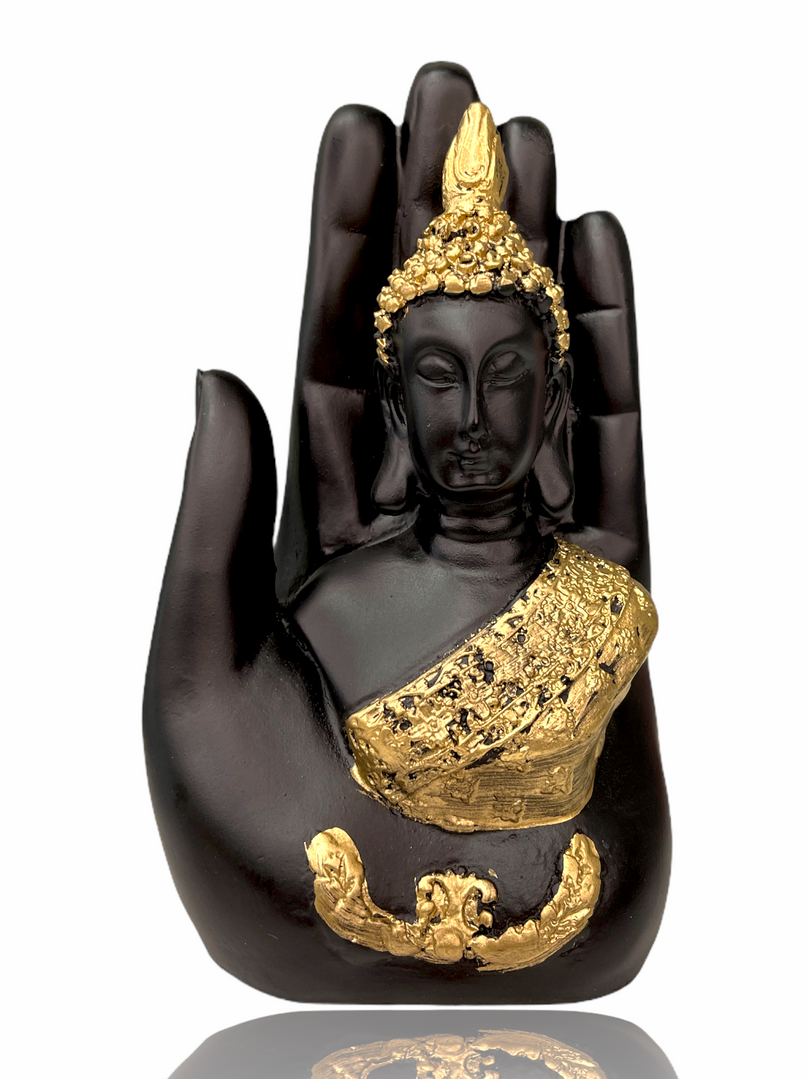 Gold/blue buddha in palm