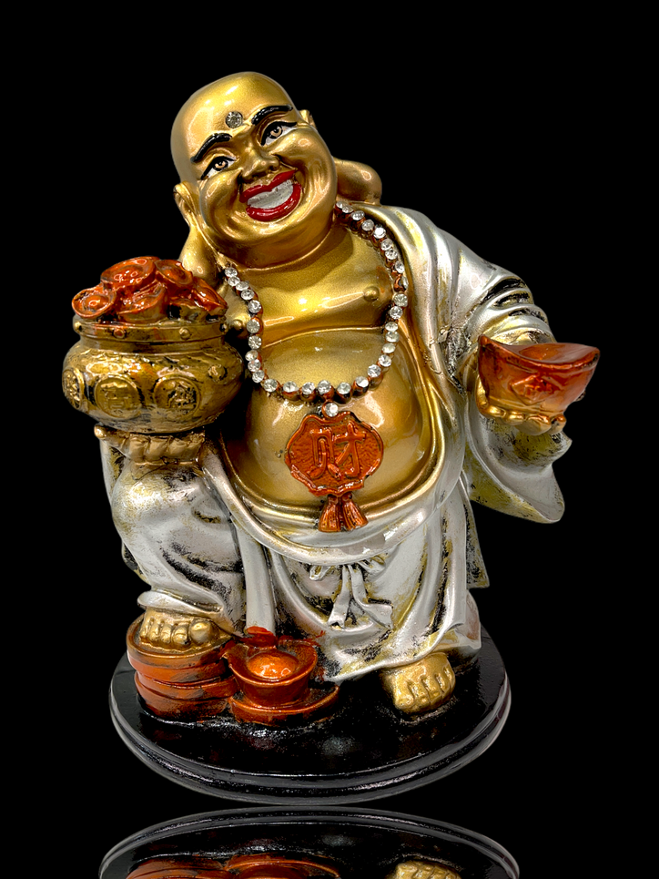 crystal studded laughing buddha holding many ingots