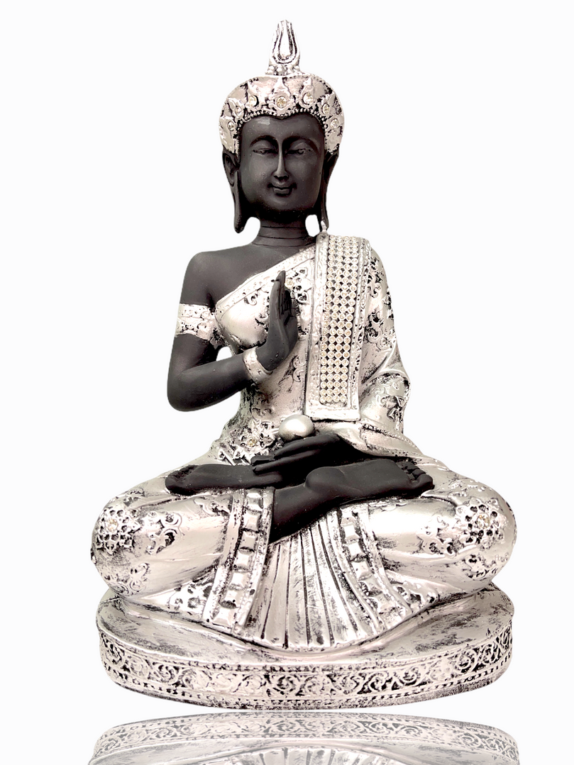 Silver crystal studded buddha sitting in meditation pose